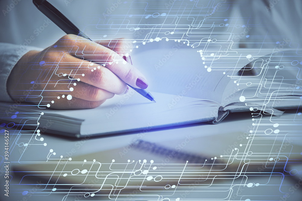 Double exposure of woman's writing hand on background with brain hologram. Concept of brainstorming. Double exposure of woman's writing hand on background with brain hologram. Concept of brainstorming.