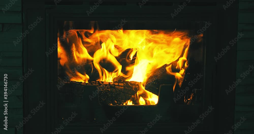 Fire is burning in the fireplace, cozy home, festive mood. 4K video Fire is burning in the fireplace, cozy home, festive mood. 4K video