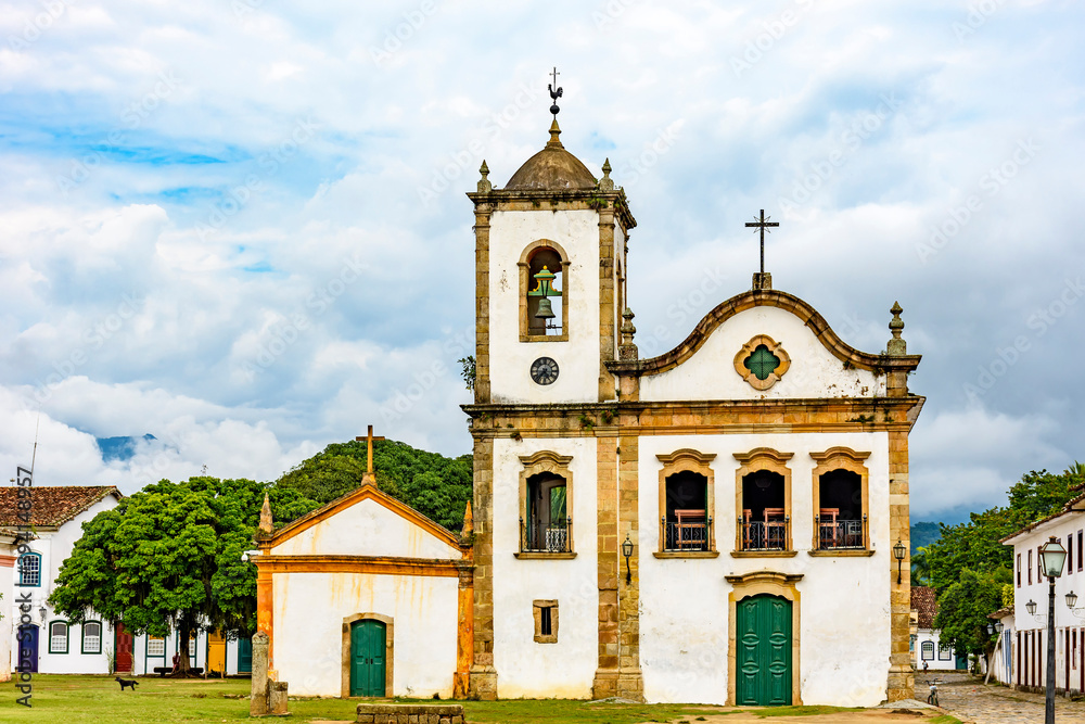 Old streets with historic church facade and houses in colonial architecture in the city of Paraty, Rio de Janeiro, Brazil