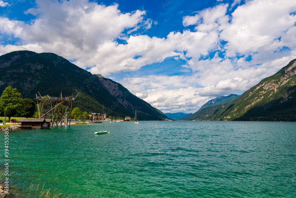 beautiful lake Achensee in summer, view to tourist health resort Pertisau and austrian alps