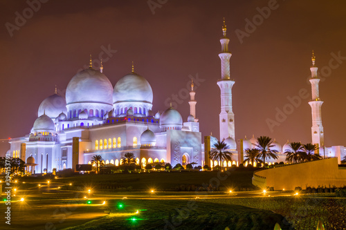 Night view of domes of Grand Mosque in Abu Dhabi, UAE, also called Sheikh Zayed Grand Mosque, inspired by Persian, Mughal and Moorish mosque architecture