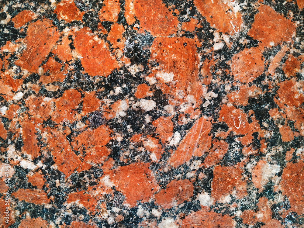 Fototapeta premium Grunge background from red granite natural stone texture. Polished surface, copy space.