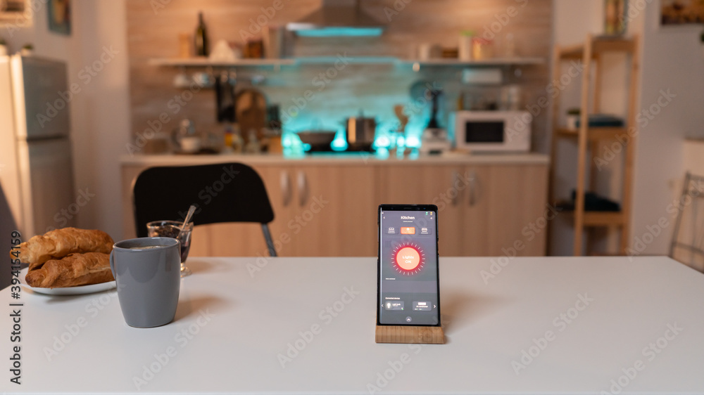 Close up smartphone with active smart home application. Phone with touching screen late at night with technology to change lights in home. Close up smartphone with active smart home application. Phone with touching screen late at night with technology to change lights in home.