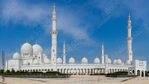 White Grand Mosque against blue sky, also called Sheikh Zayed BinSultan Nahyan Mosque, inspired by Persian, Mughal and Moorish mosque architecture, in Abu Dhabi, UAE