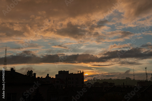 Amazing, beautiful, colorful, vivid sunset in the city, different sky and clouds © Bohdan