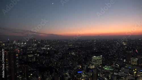 Wallpaper Mural TOKYO, JAPAN : Aerial high angle sunset CITYSCAPE of TOKYO. View of buildings around Shinjuku and Nakano ward. Japanese urban metropolis and nature concept. Long time lapse shot dusk to night. Torontodigital.ca