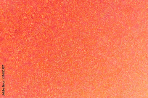 Orange frost on a glass background. texture patterned frosted glass.