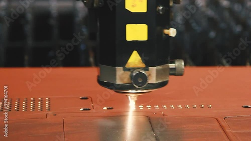 CNC Laser cutting of flat sheet metal steel material.  Industrial machine CNC plasma laser
