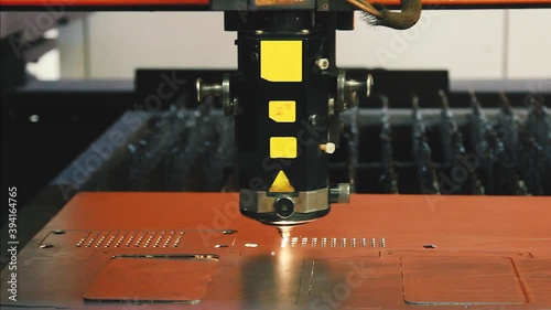 CNC Laser cutting of flat sheet metal steel material.  Industrial machine CNC plasma laser