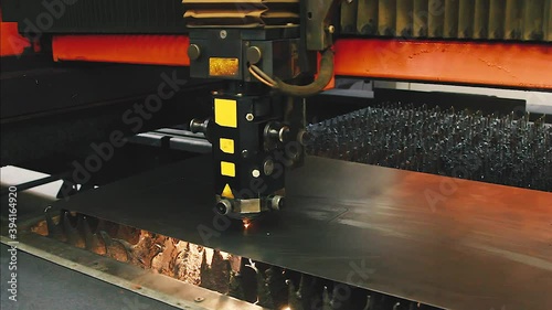CNC Laser cutting of flat sheet metal steel material.  Industrial machine CNC plasma laser