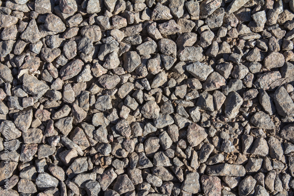 a fragment of the road surface of small stones a fragment of the road surface of small stones