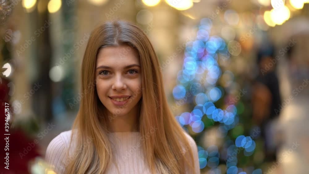 Beautiful girl on the background of the new year holiday, Slow motion Beautiful girl on the background of the new year holiday, Slow motion
