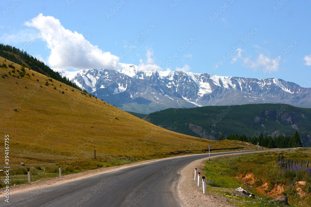 Road to the mountains. Mountain road Chuysky Tract. Route M52. The Republic of Altai, Russia. Beautiful road in the Altai mountains.