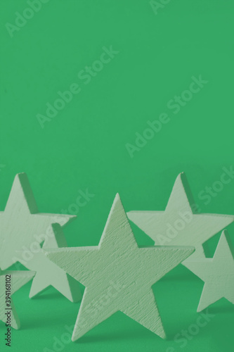 Fototapeta Naklejka Na Ścianę i Meble -  Stars on green background, representation of Christmas. 