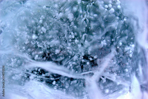 Blue blocks of ice close up with bubbles and cracks