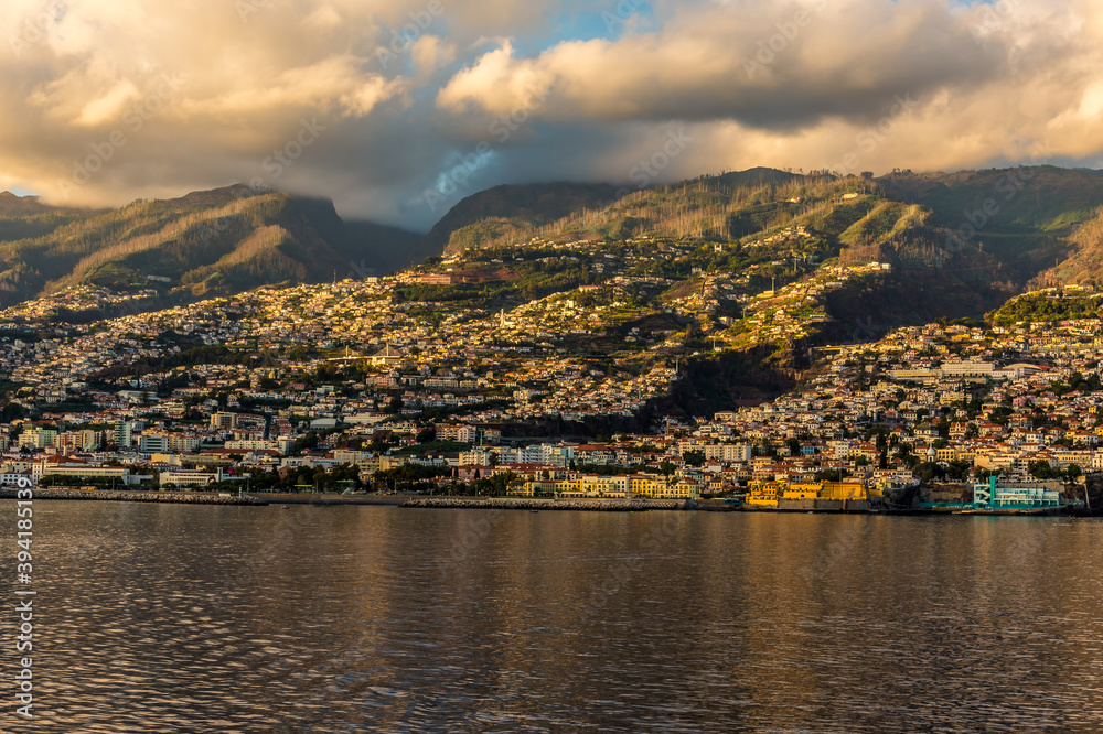 Looking back towards the city of Funchal, Madeira as the ship sails way into the sunset