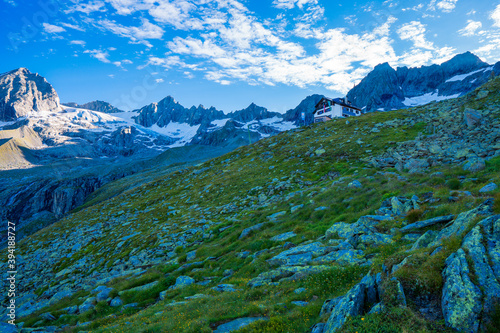 Alps Mountain Raichenspitze cold stream sunny summer day and green grass. Zillergrundl austria zillertaler alps photo