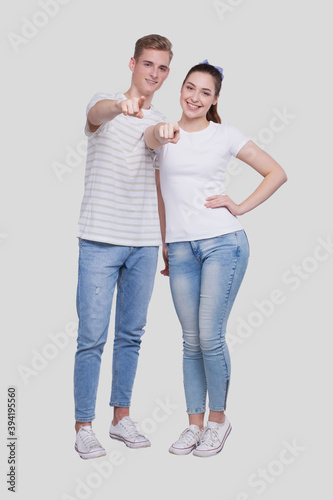 Couple Pointing to Camera Standing Isolated. Man and Woman Pointing, Lovers, Friends, Couple Concept