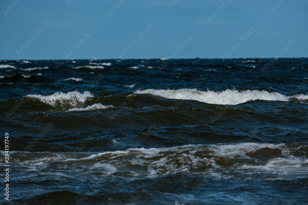 Fototapeta premium sea beach with white sand and blue water before storm