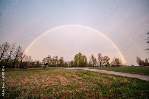 beautiful rainbow above countryside roads