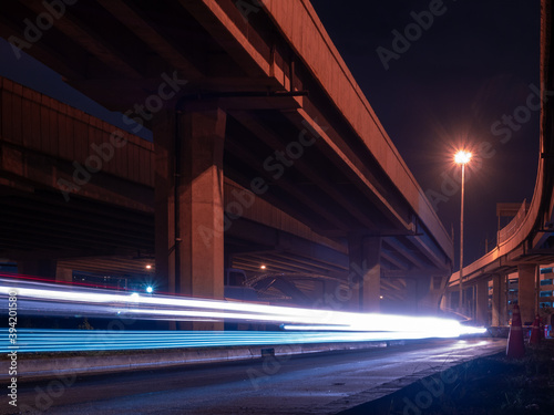 Photography Car light trails underneath the main higway in Bangkok city, Thailand