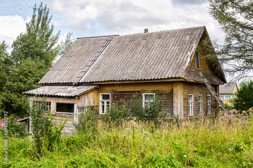 Old rural wooden house in abandoned russian village