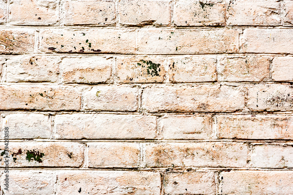 Texture of a brick wall with cracks and scratches which can be used as a background Texture of a brick wall with cracks and scratches which can be used as a background