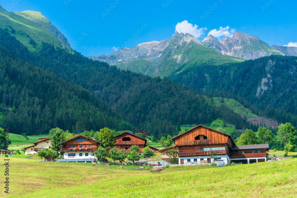 Obraz premium Mountain valley village landscape in Venediger alps . Mountain green valley village view austria near matrei in osttirol