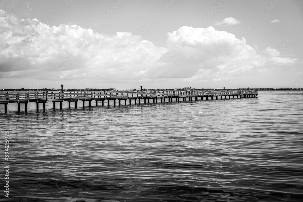 The fishing piers on Charlotte Harbor in southwest Florida in black and white.