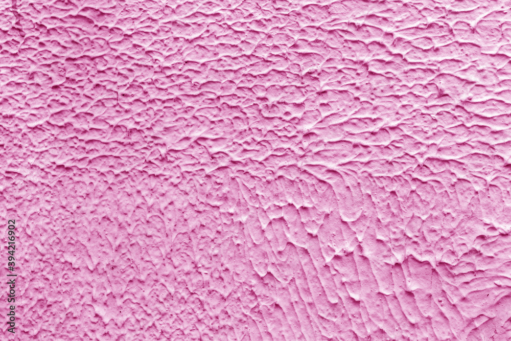 Texture of pink plaster. Interior of a modern loft. Abstract rough background. The facade of an old house.