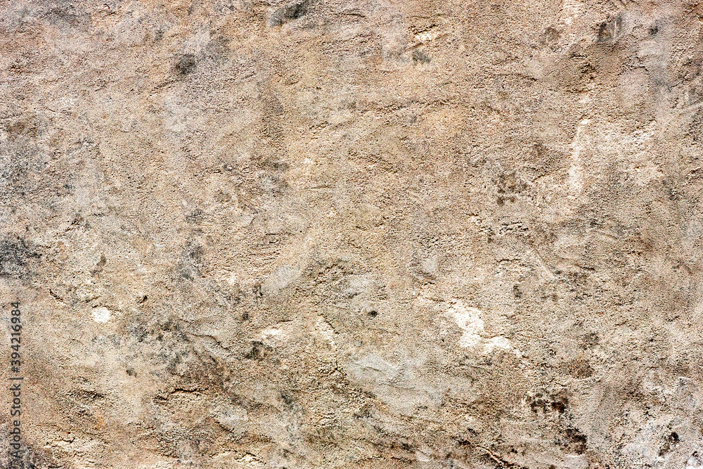Texture of a concrete wall with cracks and scratches which can be used as a background