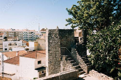 Views of the buildings of the city of Tavira from the old castle next to the Santa Maria do Castelo Church