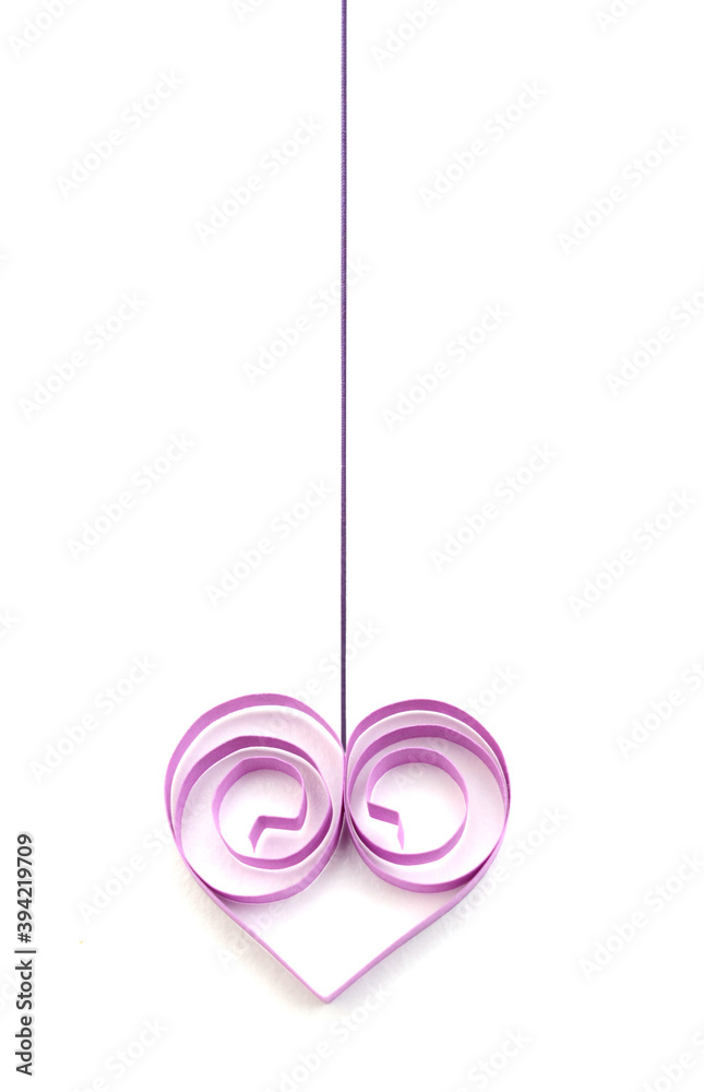 A purple quilling paper heart hanging with string A purple quilling paper heart hanging with string