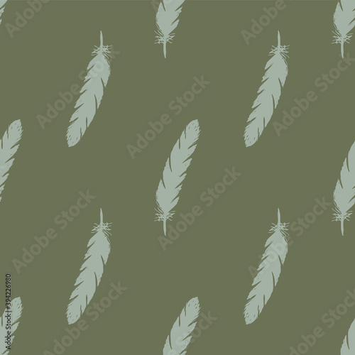Blue feathers seamless pattern on green background.