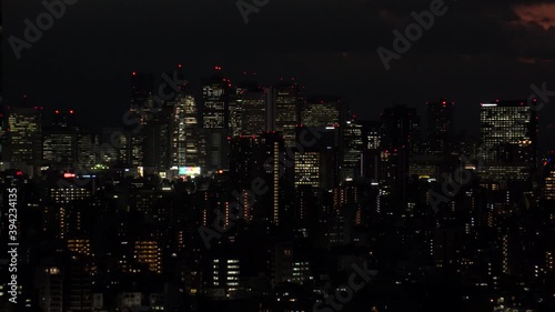 Wallpaper Mural TOKYO, JAPAN : Aerial high angle sunrise CITYSCAPE of TOKYO. View of office buildings at downtown area around Shinjuku. Japanese urban metropolis concept shot. Long time lapse shot night to morning. Torontodigital.ca