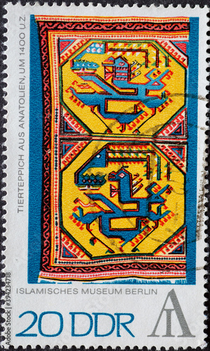 GERMANY, DDR - CIRCA 1972: a postage stamp from Germany, GDR showing an animal rug from Anatolia Turkey. Text: Islamic Museum Berlin