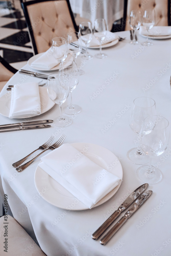 Cutlery on the table. Banquet and wedding table setting. Cutlery on the table. Banquet and wedding table setting.