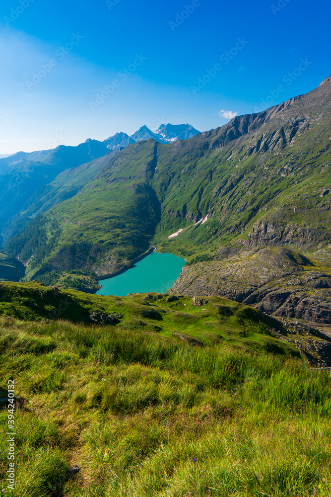 Naklejka premium The beautiful view of mountain nature with lake in Glockner alps europe- taken from The Grossglockner High Alpine Road - Grossglockner Hochalpenstrasse