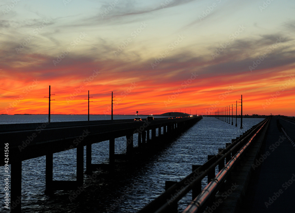 Colorful Sunset On The Way To Key West At Seven Mile Bridge On A Sunny Autumn Day With A Clear Blue Sky And A Few Clouds