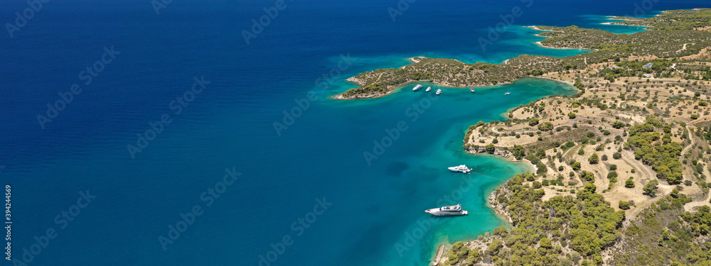 Aerial drone ultra wide panoramic photo of tropical exotic mediterranean bay with luxurious yachts and turquoise sea Aerial drone ultra wide panoramic photo of tropical exotic mediterranean bay with luxurious yachts and turquoise sea