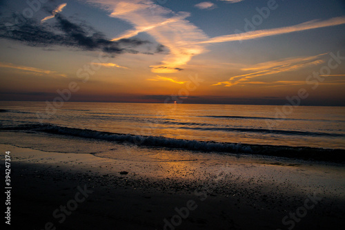 Sunset blue and orange sky by the beach © kristof Leffelaer