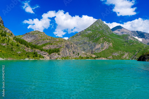 The beautiful view of mountain nature with lake in Glockner alps europe- taken from The Grossglockner High Alpine Road - Grossglockner Hochalpenstrasse photo