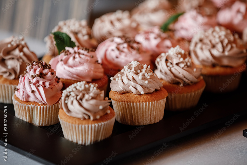 Cupcakes with curls of creamy strawberry glaze Cupcakes with curls of creamy strawberry glaze