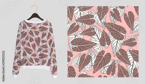 Trendy modern print for fabrics and textiles. Seamless tropical pattern. Palm leaves on a pink background