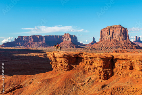 John Ford's viewpoint in Monument Valley Navajo Tribal Park with a unrecognizable Navajo Horseman staging the scene of the movie Stagecoach, Arizona, USA. photo