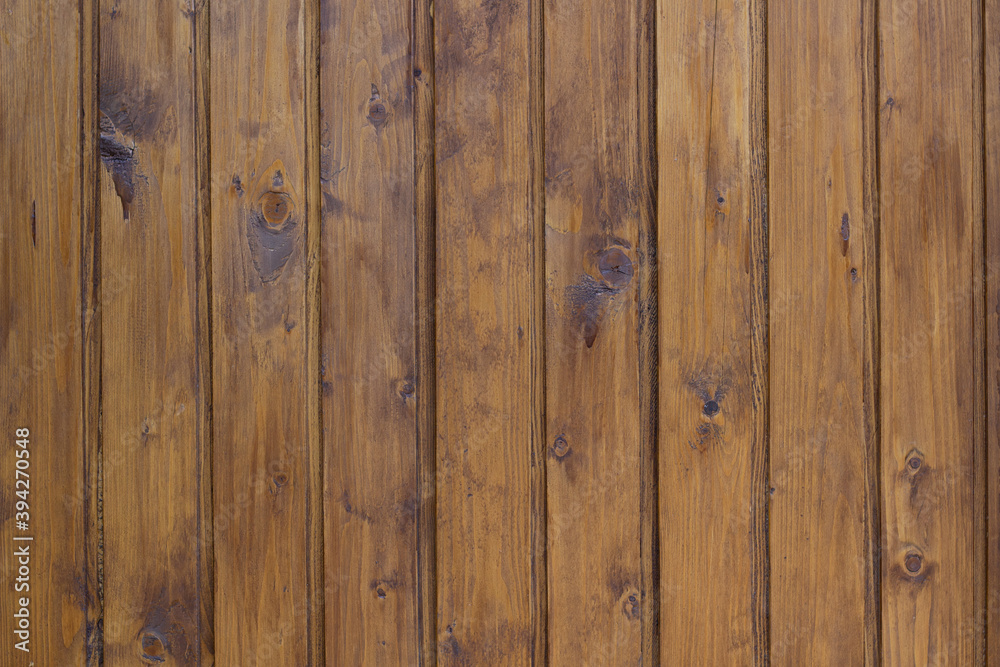 Stained brown wooden wall background. Painted wood background.