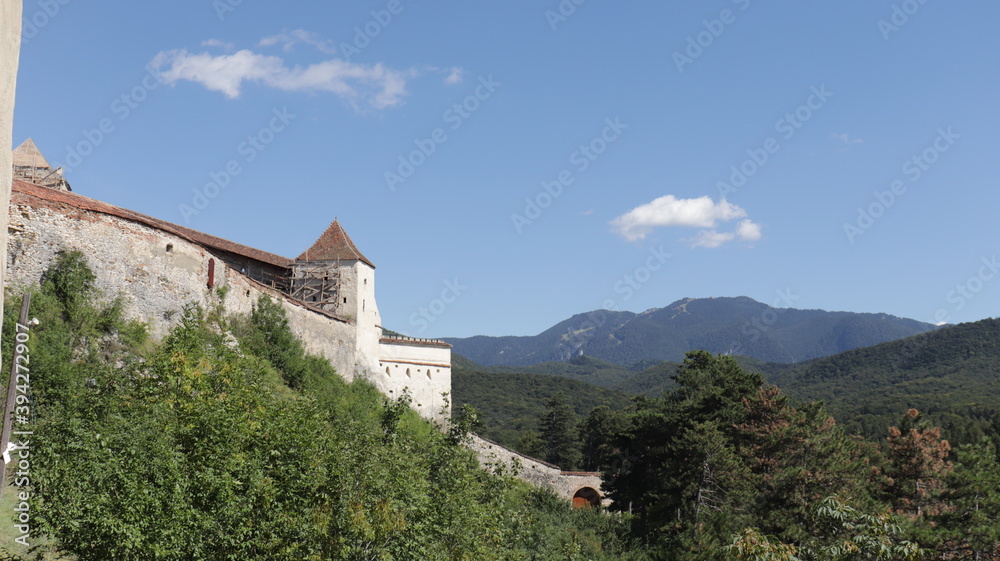 rasnov castle with brasov mountains in the background