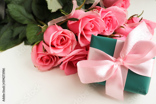 gift box with pink ribbon and rose