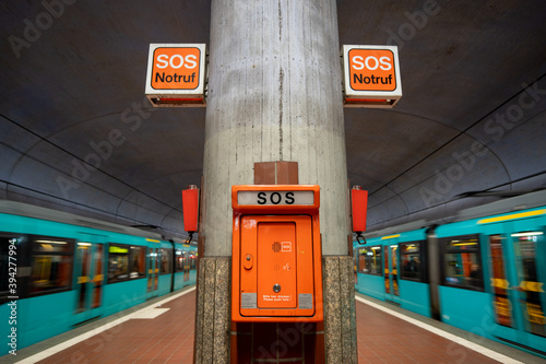 Emergency SOS telephone in a subway station in Frankfurt am Main, Germany