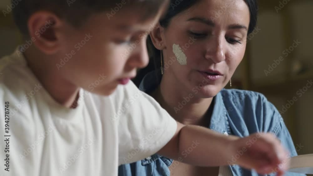 Mother and son plays with clay at home Mother and son plays with clay at home